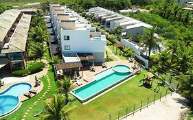 Casa Turquesa Pé na areia Piscina infinita Pet friendly Condomínio fechado